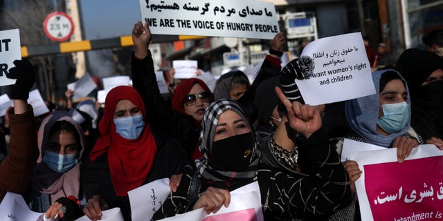 Afghan women shout slogans during a rally to protest what protesters refer to as Taliban restrictions on women, in Kabul, Afghanistan, December 28, 2021. 