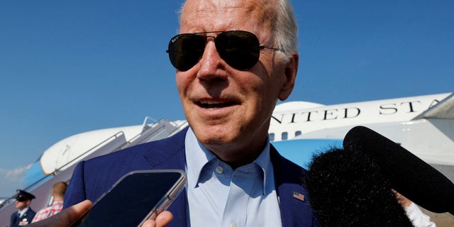 President Joe Biden speaks to the media as he arrives at Joint Base Andrews, Maryland.