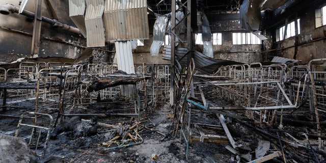 Burnt bodies of detainees lie among debris following the shelling at a pre-trial detention center in the settlement of Olenivka in the Donetsk Region, Ukraine, July 29, 2022.