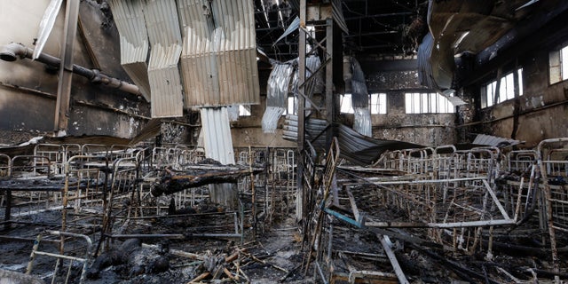 Burnt bodies of detainees lie among debris following the shelling at a pre-trial detention center in the settlement of Olenivka in the Donetsk Region, Ukraine, July 29, 2022.