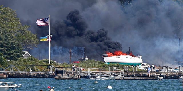 A multi-alarm fire rips through the Mattapoisett Boat Yard on Ned's Point Road in Mattapoisett, Massachusetts, Aug. 19, 2022.  