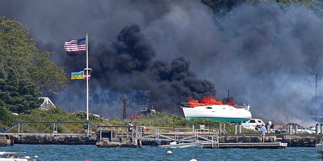 A multi-alarm fire rips through the Mattapoisett Boat Yard on Ned's Point Road in Mattapoisett, Massachusetts, Aug. 19, 2022.  