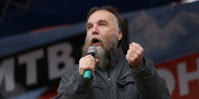 Russian politologist Alexander Dugin gestures as he addresses the rally "Battle for Donbas" in support of the self-proclaimed Donetsk and Luhansk People's Republics, in Moscow, Russia October 18, 2014. 