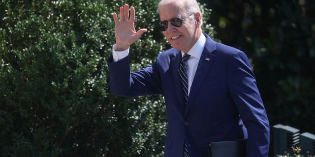 US President Joe Biden greets people on the South Lawn after arriving on Marine One from a trip to Delaware at the White House in Washington, US, August 24, 2022.