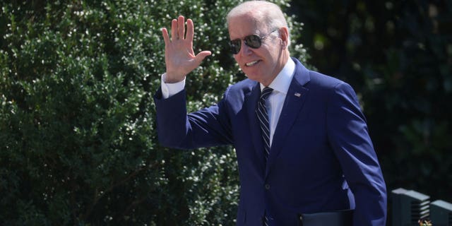 U.S. President Joe Biden greets people on South Lawn after arriving on Marine One from a trip to Delaware at the White House in Washington, U.S., August 24, 2022.