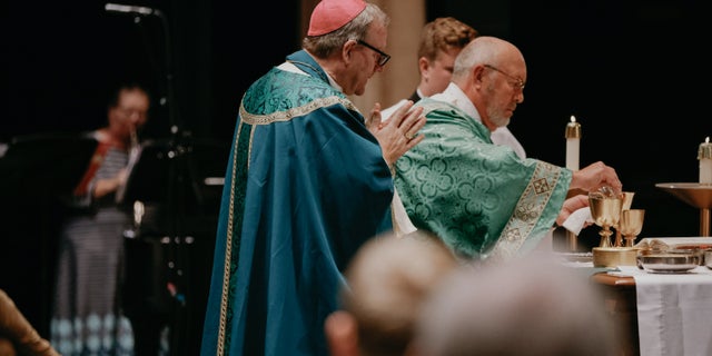 Bishop Robert Barron of the Diocese of Rochester, Minnesota celebrates Mass at Lourdes High School