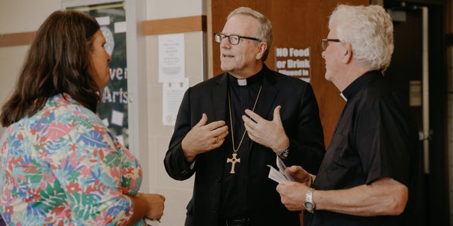 Bishop Robert Barron of the Diocese of Rochester, Minnesota (center)