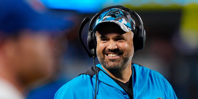 Carolina Panthers head coach Matt Rhule smiles during the first half of an NFL preseason football game against the Buffalo Bills on Friday, Aug. 26, 2022, in Charlotte, N.C.