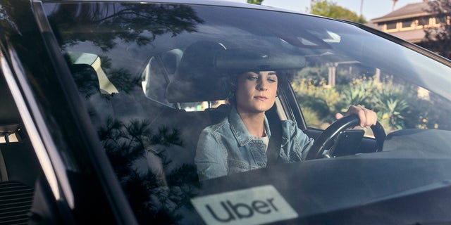 An Uber driver is shown heading out on a trip.