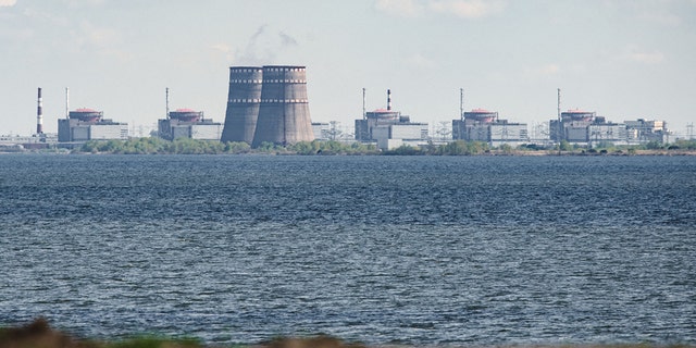 A general view shows the Zaporizhzhia nuclear power plant, situated in the Russian-controlled area of Enerhodar, seen from Nikopol in April 27, 2022. 