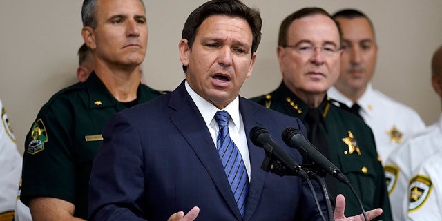 Florida Gov. Ron DeSantis gestures as he speaks during a news conference Thursday, Aug. 4, 2022, in Tampa, Fla. DeSantis announced that he was suspending State Attorney Andrew Warren, of the 13th Judicial Circuit, due to "neglect of duty." (AP Photo/Chris O'Meara)