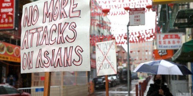 Signs condemning violence against Asians are posted in front of a store in Chinatown March 18, 2021, in San Francisco. 