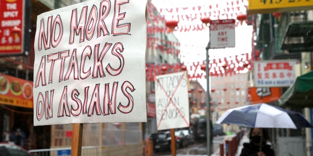 Signs condemning violence against Asians are posted in front of a store in Chinatown March 18, 2021, in San Francisco. 