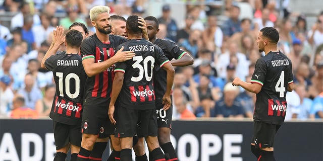 Olivier Giroud #9 of AC Milan celebrates after scoring the second goal during the Friendly match between Marseille and AC Milan at the Orange Velodrome on July 31, 2022 in Marseille, France. 