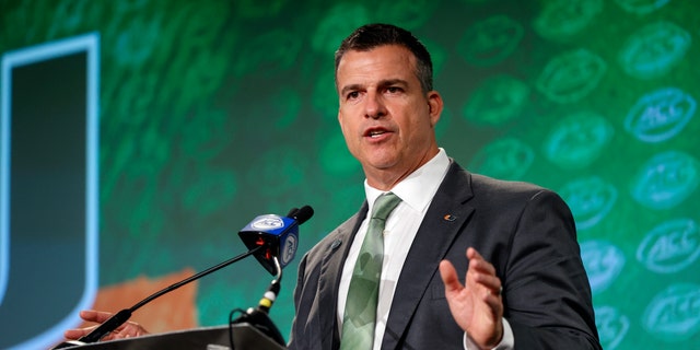 Miami head coach Mario Cristobal answers a question at the NCAA college football Atlantic Coast Conference Media Days in Charlotte, North Carolina. Cristobal's first camp as the Miami coach is set to begin Friday.