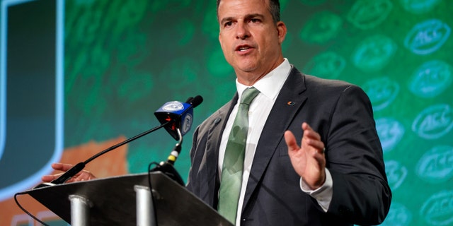 Miami head coach Mario Cristobal answers a question at the NCAA college football Atlantic Coast Conference Media Days in Charlotte, North Carolina. Cristobal's first camp as the Miami coach is set to begin Friday.