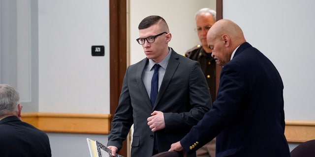 Volodymyr Zhukovskyy, seen here entering a courtroom at Coos County Superior Court in Lancaster, N.H., on July 25, 2022, has pleaded not guilty to multiple counts of negligent homicide, manslaughter, reckless conduct, and driving under the influence in the crash.