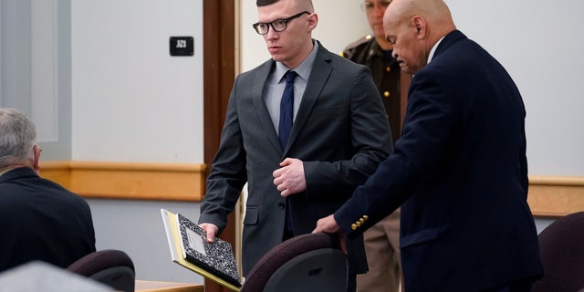 Volodymyr Zhukovskyy, seen here entering a courtroom at Coos County Superior Court in Lancaster, N.H., on July 25, 2022, has pleaded not guilty to multiple counts of negligent homicide, manslaughter, reckless conduct, and driving under the influence in the crash.