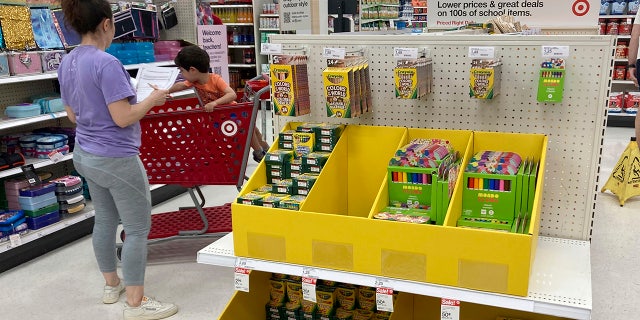 A parent shops for school supplies at a Target store, Wednesday, July 27, 2022, in North Miami, Fla. 