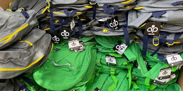 Backpacks and school supplies are unpacked at a Chicago Public Schools back-to-school supply giveaway at Theodore Roosevelt High School in Chicago, on July 22, 2022.