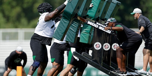New York Jets guard Mekhi Becton participates in drills during the NFL football team's training camp at Florham Park, NJ, Thursday, July 28, 2022. On Monday, Becton went down with a knee injury.