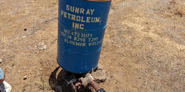 A well leaking methane, pictured here near Bakerfield, California. State officials have not taken methane leaks into account when determining state's total carbon emissions.