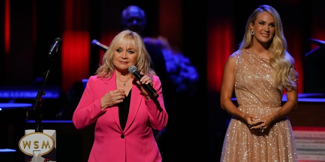 Barbara Mandrell, links, came on stage at the Grand Ole Opry after Carrie Underwood, right sang her own version of Mandrell's 'I Was Country Before Country Was Cool.'