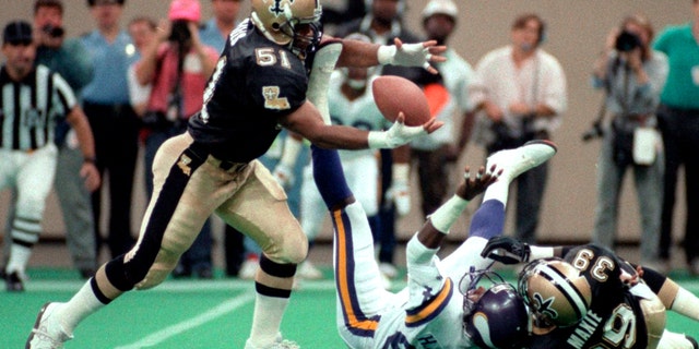 New Orleans Saints' Sam Mills grabs a fumble during the team's NFL football game against the Minnesota Vikings on Sept. 22, 1991, in New Orleans. Mills played Division III college football and was not drafted. That made his rise to stardom with the Saints and Carolina Panthers and his enshrinement in the Pro Football Hall of Fame in Canton, Ohio, this weekend all the more remarkable.
