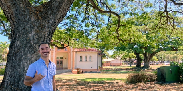 Sautia Tanoa poses for a photo while visiting his former high school in Honolulu on Friday, July 29, 2022. Tanoa is among the McKinley High School graduates who want to see the name restored to Honolulu High School out of respect for Hawaiian culture and history. Some alumni say changing the name would rattle their identity.