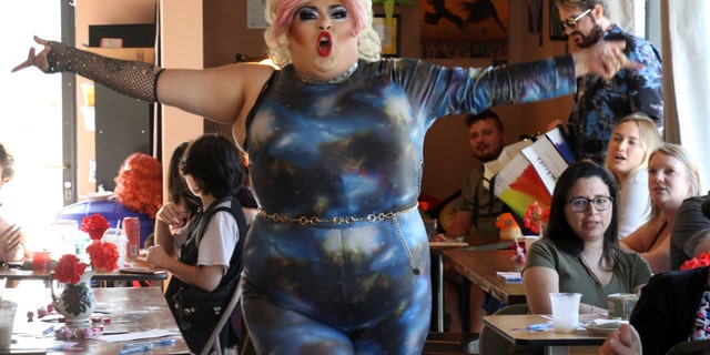 This July 28, 2022, photo shows drag queen Dela Rose performing in a mock election at Cafecito Bonito in Anchorage, Alaska where, people ranked the performances by drag performers. 