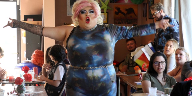 This July 28, 2022, photo shows drag queen Dela Rose performing in a mock election at Cafecito Bonito in Anchorage, Alaska where, people ranked the performances by drag performers. 