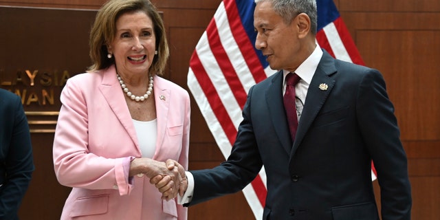 This handout photo taken and released by Malaysia’s Department of Information, U.S. House Speaker Nancy Pelosi, left, meets with Malaysia Parliament speaker Azhar Azizan Harun at the parliament house in Kuala Lumpur, Tuesday, Aug. 2, 2022. 