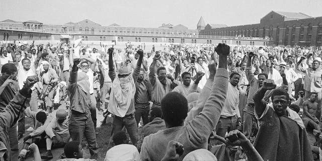 Inmates at Attica State Prison in Attica, New York, raise their hands in a show of unity during the Attica uprising, which took the lives of 43 people. New York authorities have lifted a ban that had stopped state prison inmates from reading a book about the 1971 Attica Correctional Facility uprising following a First Amendment lawsuit brought by its author. 