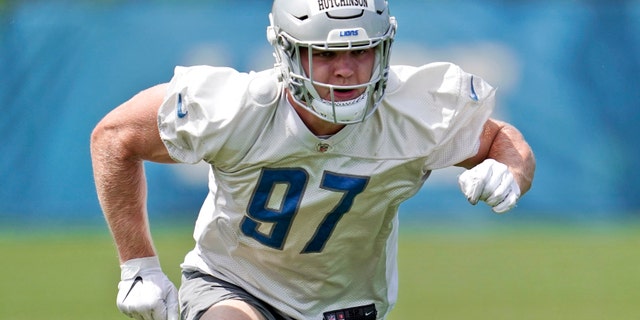 Detroit Lions defensive end Aidan Hutchinson works out during an NFL football practice in Allen Park, Michigan. Hutchinson has been turning heads since he was drafted by the Lions.