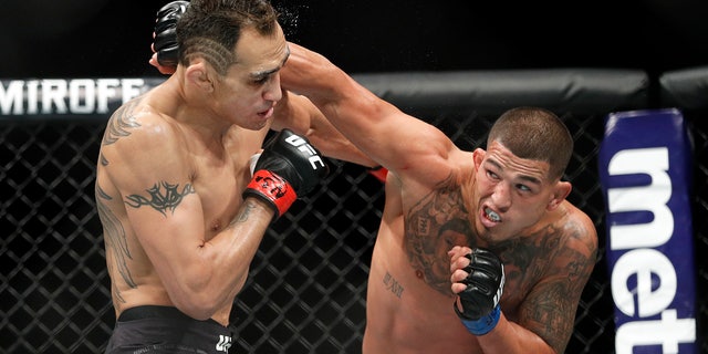 Anthony Pettis, right, punches Tony Ferguson during a lightweight mixed martial arts bout at UFC 229 in Las Vegas. Pettis is slated to fight Stevie Ray in the Professional Fighters League playoffs Friday night at the Hulu Theater at Madison Square Garden in New York.