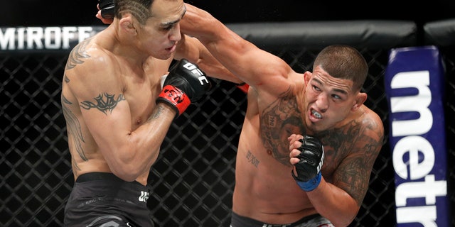 Anthony Pettis, right, punches Tony Ferguson during a lightweight mixed martial arts bout at UFC 229 in Las Vegas. Pettis is slated to fight Stevie Ray in the Professional Fighters League playoffs Friday night at the Hulu Theater at Madison Square Garden in New York.