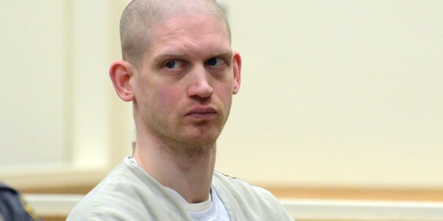 Andrew Samuolis listens to Connecticut state prosecutors during his sentencing. The Connecticut Supreme Court ruled Thursday in a murder case that police were justified in entering the defendant's home without a warrant after observing an infestation of flies at a window.
