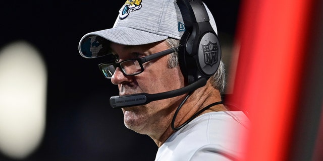 Jacksonville Jaguars coach Doug Pederson said Thursday, Aug.  4, 2022, watches from the sideline during the first half of the team's NFL football exhibition Hall of Fame game against the Las Vegas Raiders in Canton, Ohio.  The Jaguars play the Browns in their second preseason game.