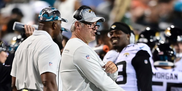 Jacksonville Jaguars coach Doug Pederson (center) looks out for the first half of the NFL Football Exhibition Hall of Fame game against the Las Vegas Raiders on Thursday, Aug. 4, 2022 in Canton, Ohio. 