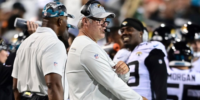 Jacksonville Jaguars coach Doug Pederson, center, watches from the sideline during the first half of the NFL Football Hall of Fame game against the Las Vegas Raiders on Thursday, Aug. 28 . 4, 2022, in Canton, Ohio.