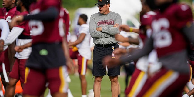 Washington Commanders head coach Ron Rivera watches his team during practice at its training facility Aug. 5, 2022, in Ashburn, Va. 