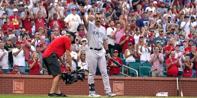 The New York Yankees' Matt Carpenter tips his cap as he steps up to bat during the first inning against the St. Louis Cardinals Friday, Aug. 5, 2022, in St. Louis. 