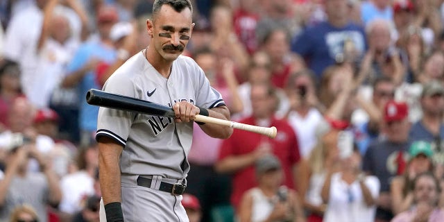 The New York Yankees' Matt Carpenter looks into the St. Louis Cardinals' dugout as he steps up to bat during the first inning Friday, Aug. 5, 2022, in St. Louis.