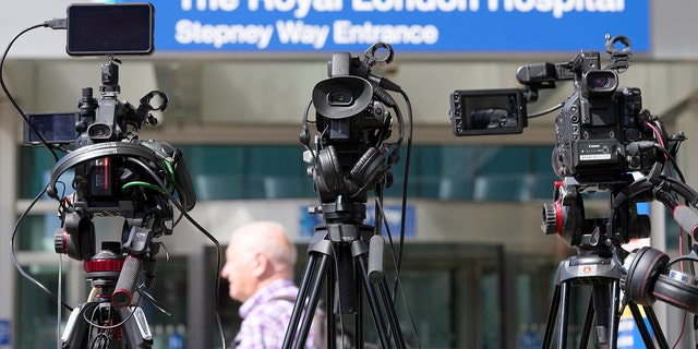 Journalists' cameras are lined up at the entrance to the Royal London Hospital in London, Friday August 5, 2022. 