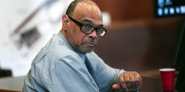 Shaun Harrison, above, reacts as attorneys give closing arguments in his trial in Suffolk Superior Court in Boston.  Harrison, a former dean at a Boston high school known affectionately by students as 