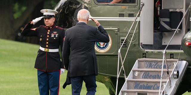 President Joe Biden salutes as he boards Marine One on his way to his Rehoboth Beach, Delaware, home, Sunday, Aug. 7, 2022.