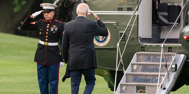 President Joe Biden salutes as he boards Marine One on the South Lawn of the White House in Washington, D.C., en route to Rehoboth Beach, Del., his home after the latest COVID-19 self-isolation, Sunday, Aug. 7, 2022.