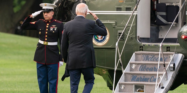 President Joe Biden salutes as he boards Marine One on his way to his Rehoboth Beach, Delaware, home, Sunday, Aug. 7, 2022.