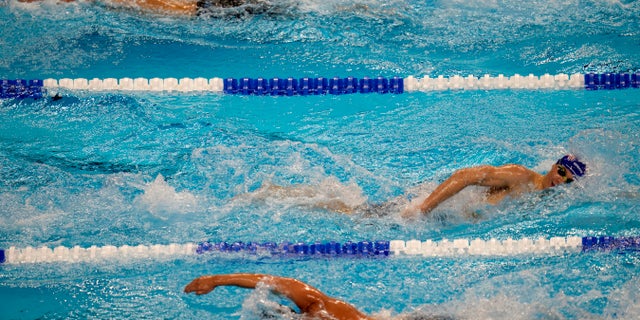 Swimmers compete during the U.S. Olympic Swimming trials. USA Swimming has added technology to its abuse-reporting systems that will allow better communication between investigators and reporters who want to remain anonymous. The organization announced a deal with RealResponse, which is international Safe Sport Day.