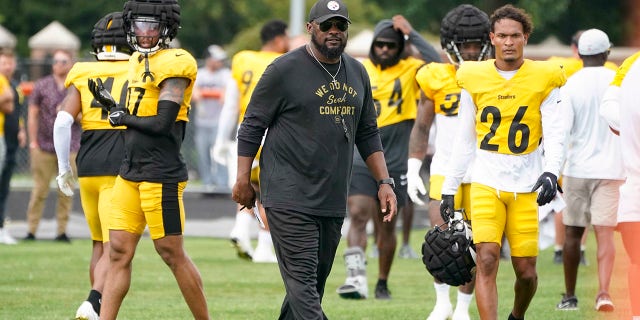 Pittsburgh Steelers head coach Mike Tomlin walks between practices with his team during practice at training camp at Latrobe Memorial Stadium in Latrobe, Pennsylvania, Monday, Aug. 8, 2022.